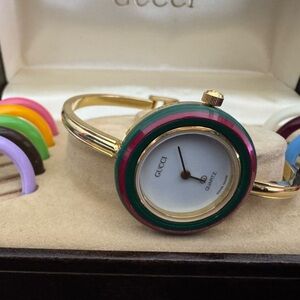 Gucci Gold-Tone Bangle Watch with Pink and Green Bezel